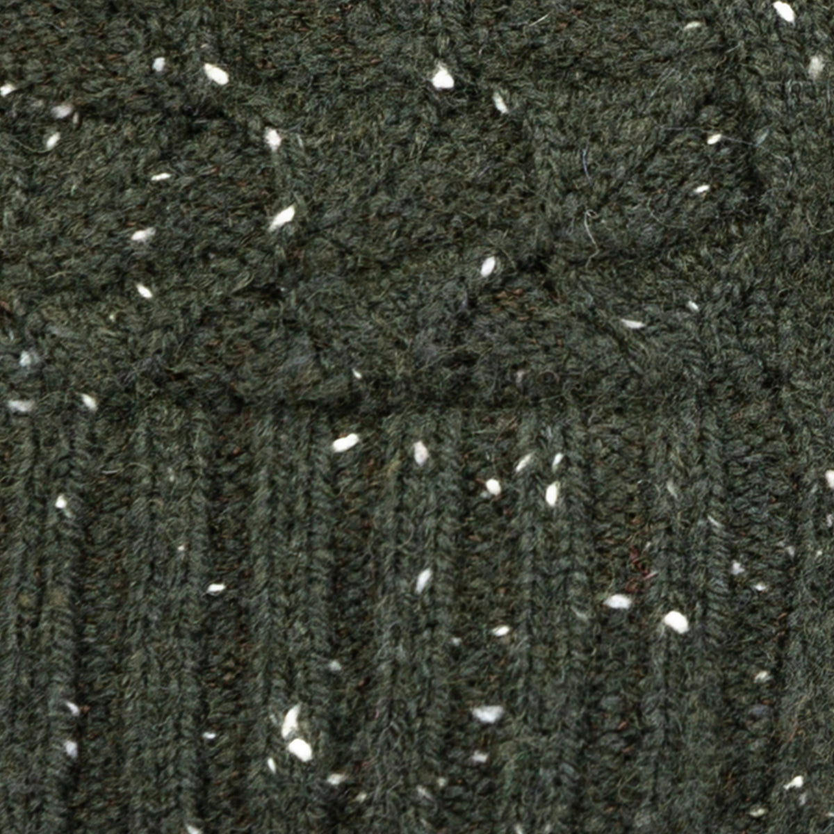 Women's lace knit gloves with marl yarn in green, fabric close up.