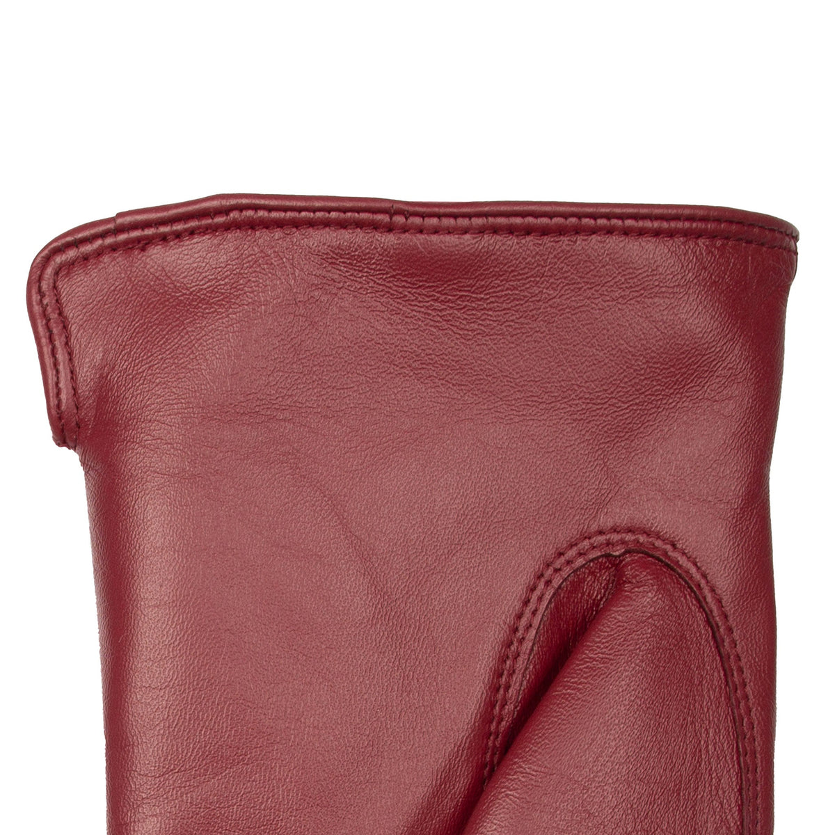 Women's touchscreen single point faux fur lined leather gloves in red, left hand close up.