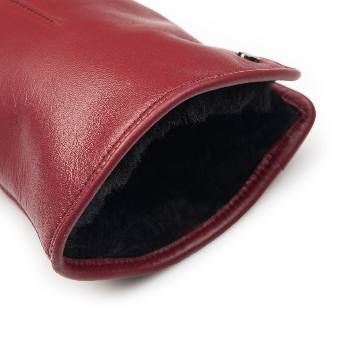 Women's touchscreen single point faux fur lined leather gloves in red, cuff.