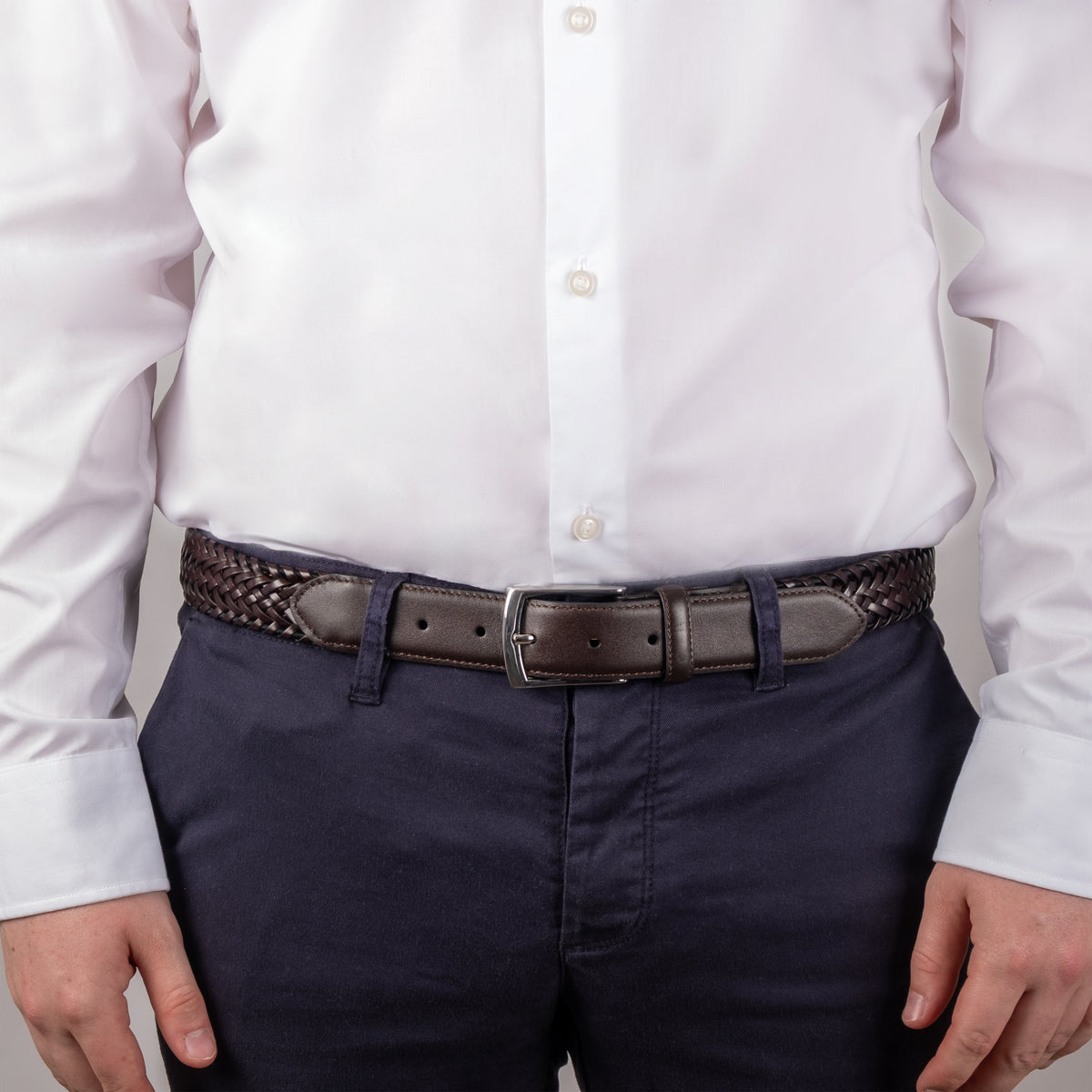 Men's woven leather belt with satin nickel buckle in brown, close up