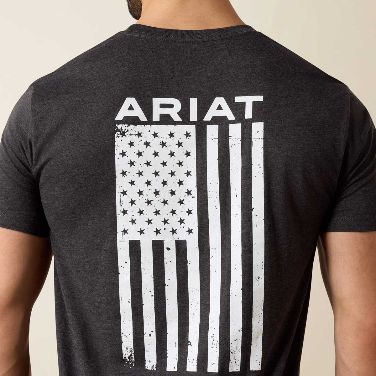 Black t-shirt with American flag design and 'Ariat' branding on the back.
