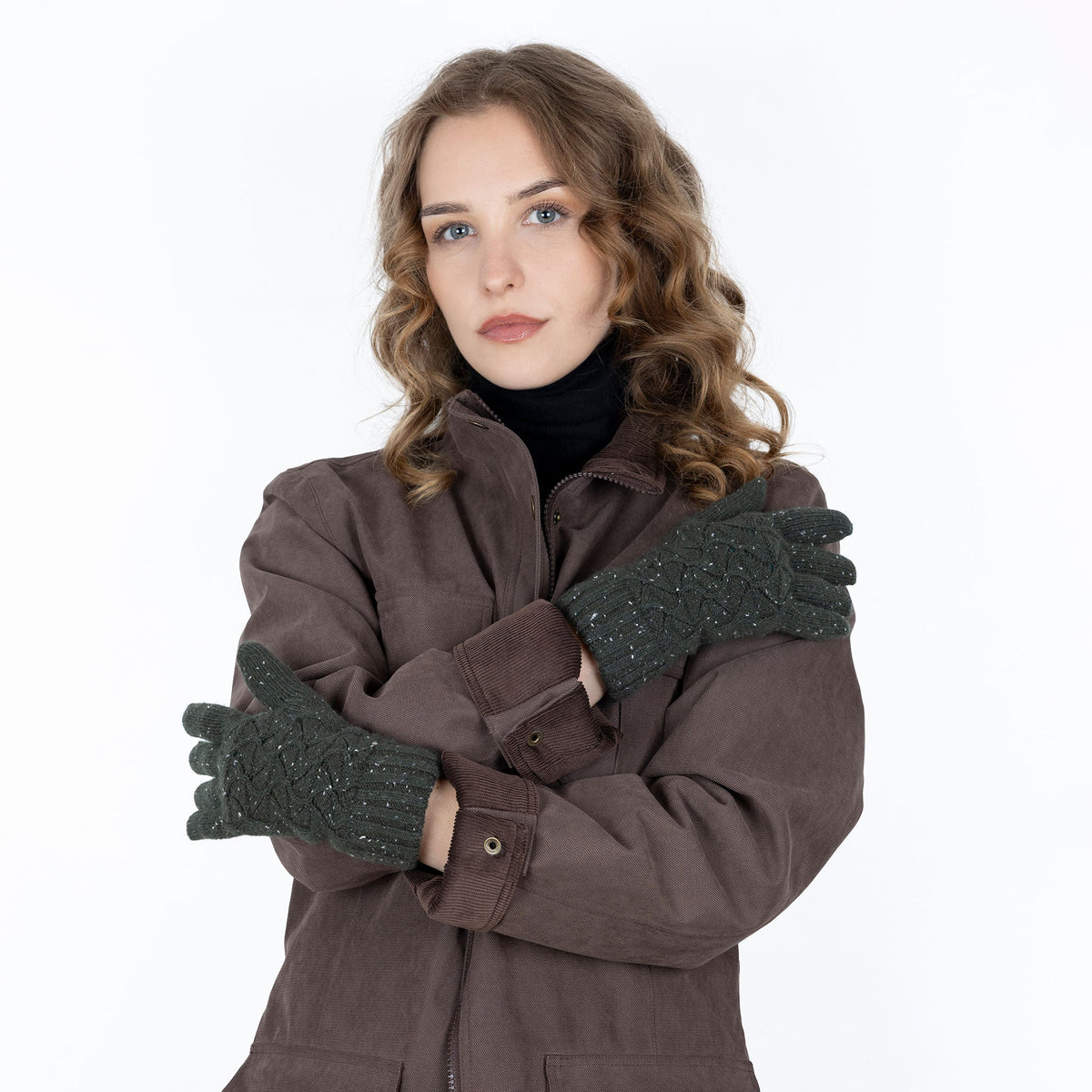 Woman wearing green lace knit gloves with marl yarn