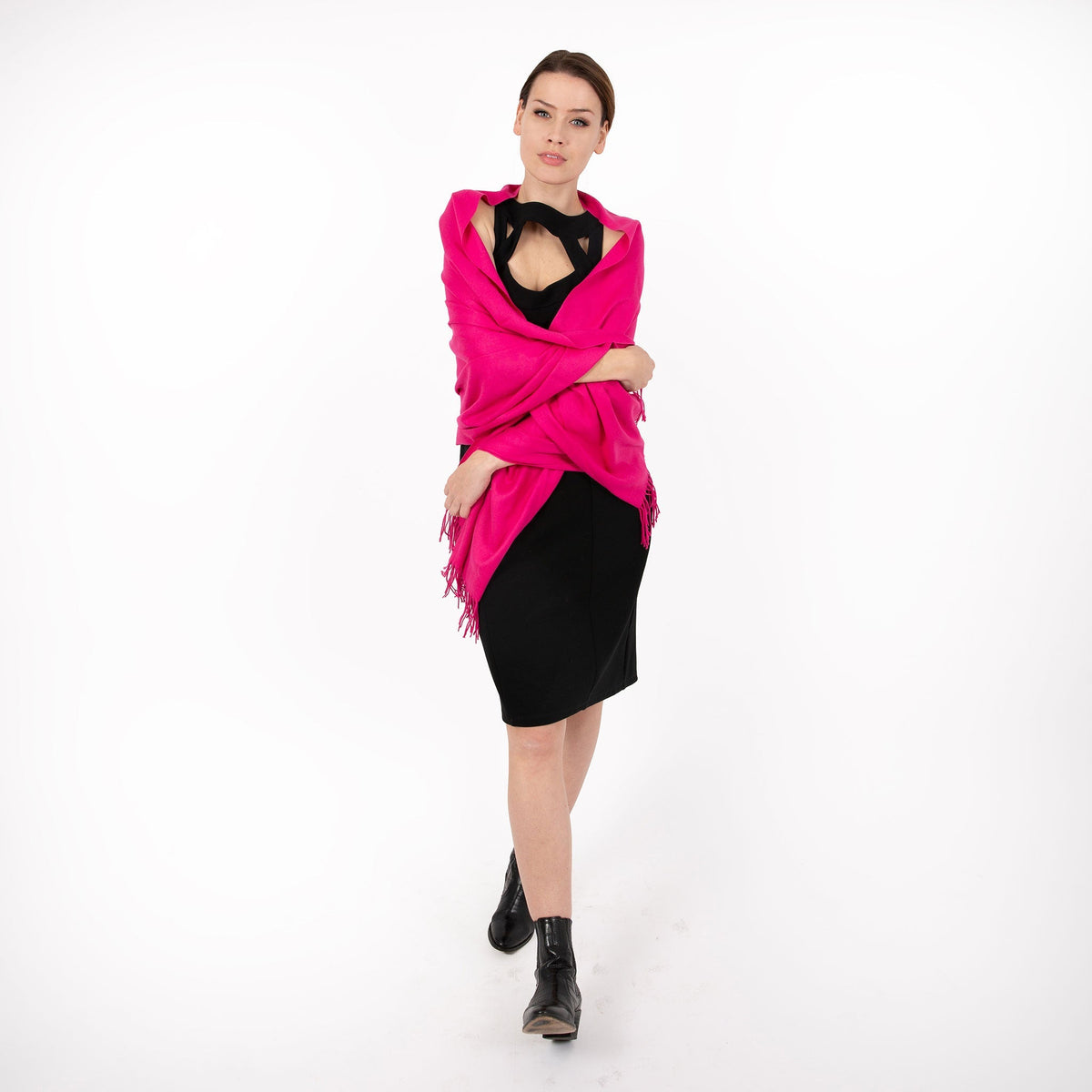 Woman wearing plain pashmina shawl in fuchsia - draped over her shoulders