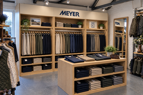 Meyer trouser display with oak shelving and folded chinos