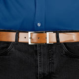 Men’s heritage reversible full-grain leather belt with satin nickel buckle in black/tan, buckle close up. 