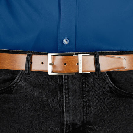 Men’s heritage reversible full-grain leather belt with satin nickel buckle in black/tan, buckle close up. 