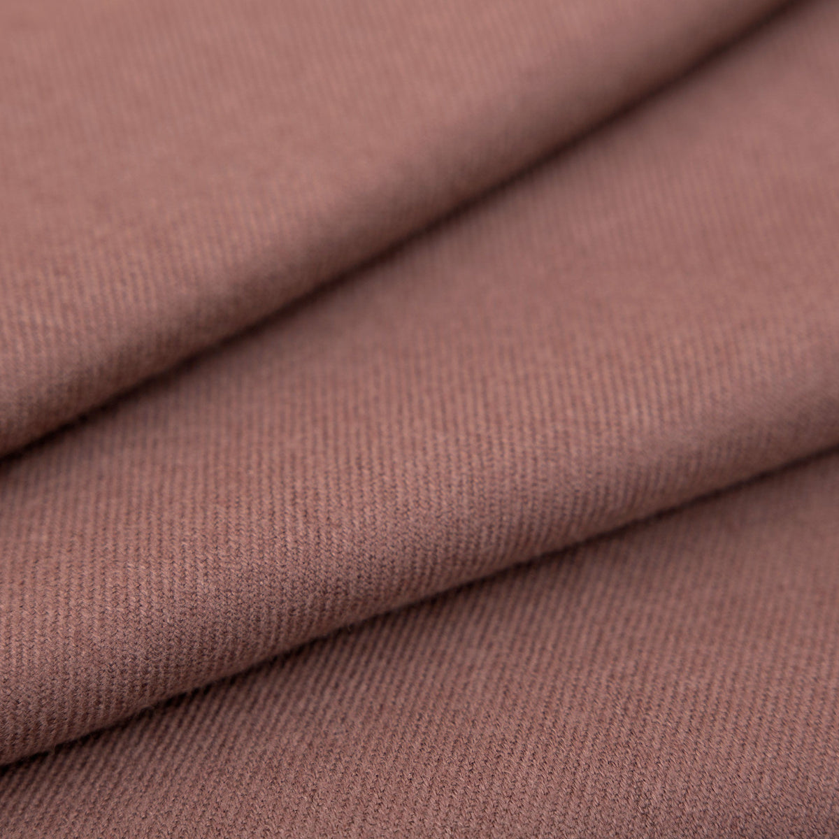 Women's plain pashmina shawl in brown close up of fabric.
