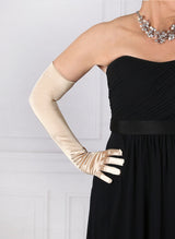 Woman wearing gold opera satin gloves with an evening dress