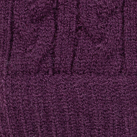 Women's cable knit gloves in purple, fabric close up. 