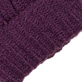 Women's cable knit gloves in purple, cuff close up. 