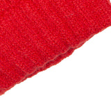 Women's cable knit gloves in red, cuff close up. 