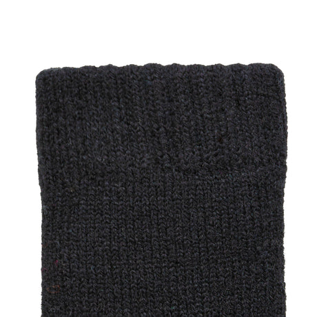 Women's cable knit gloves in black, left hand close up. 