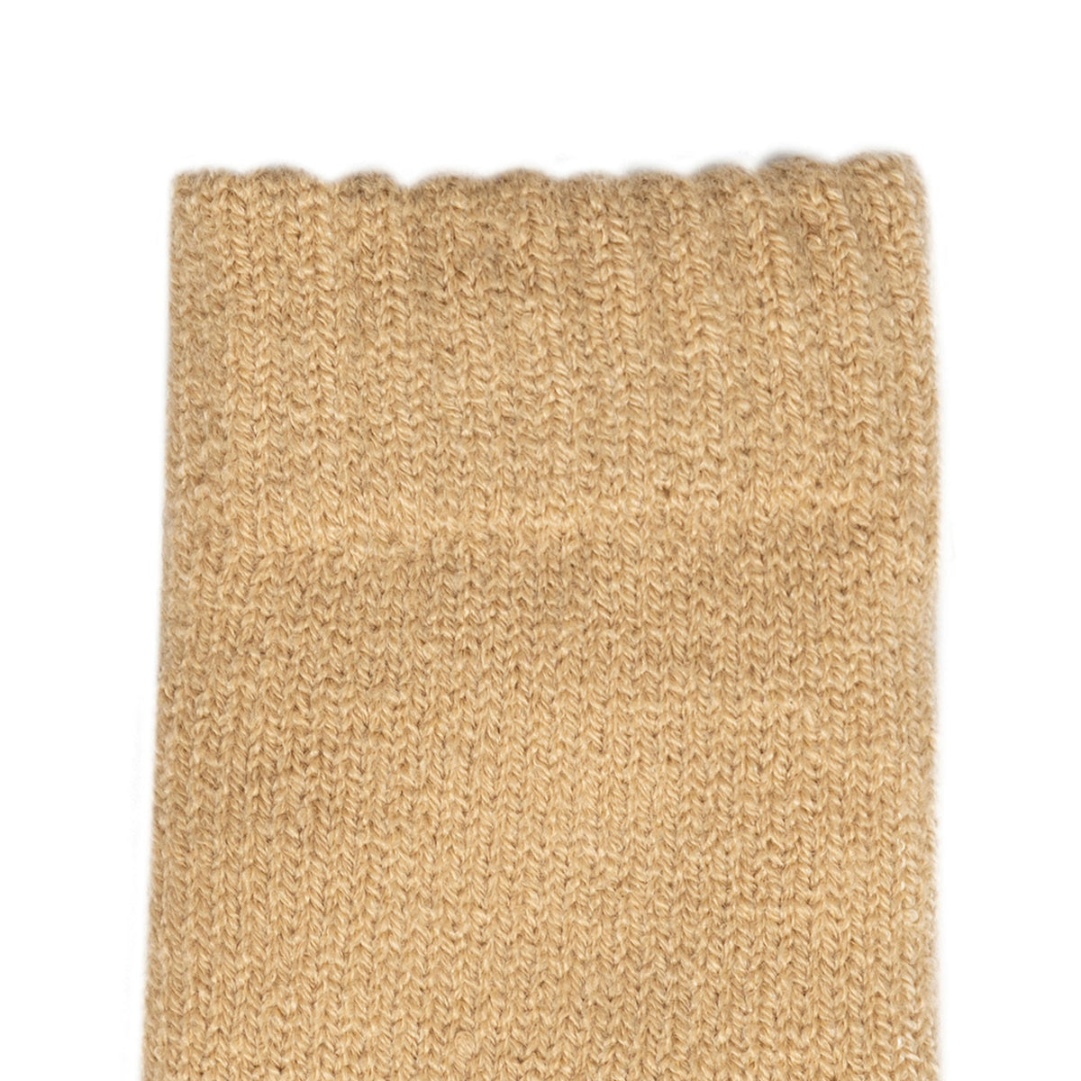 Women's cable knit gloves in beige, left hand close up.