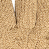 Women's cable knit gloves in beige, fingers close up. 