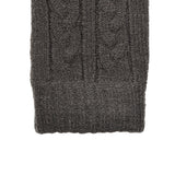 Women's cable knit gloves in dark grey, right hand close up. 