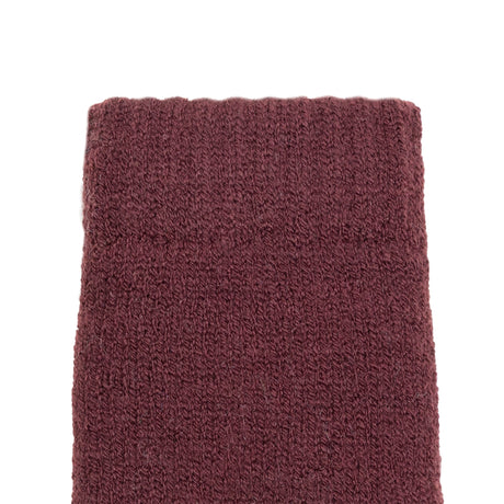 Women's cable knit gloves in burgundy, left hand close up. 