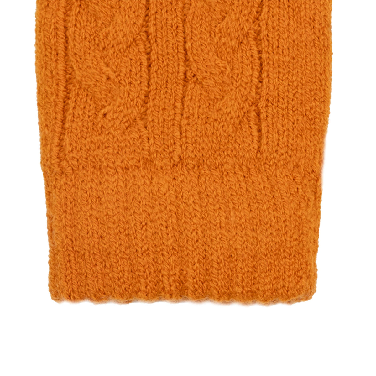 Women's cable knit gloves in orange, right hand close up. 