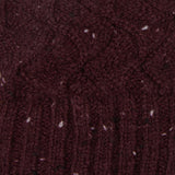 Women's lace knit gloves with marl yarn in burgundy, fabric close up.