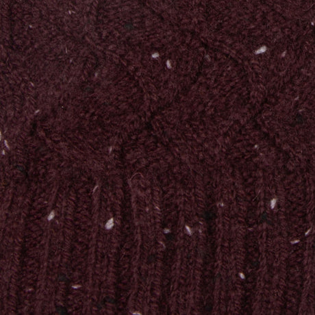 Women's lace knit gloves with marl yarn in burgundy, fabric close up.