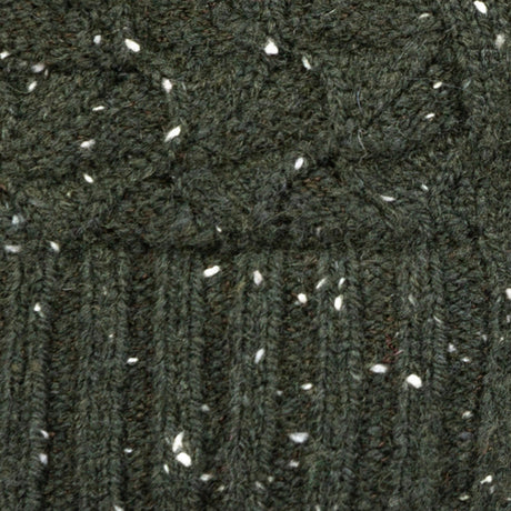 Women's lace knit gloves with marl yarn in green, fabric close up.