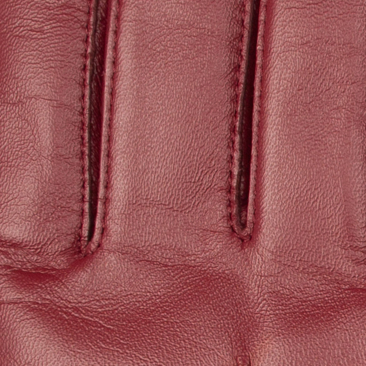 Women's touchscreen single point faux fur lined leather gloves in red, fingers.