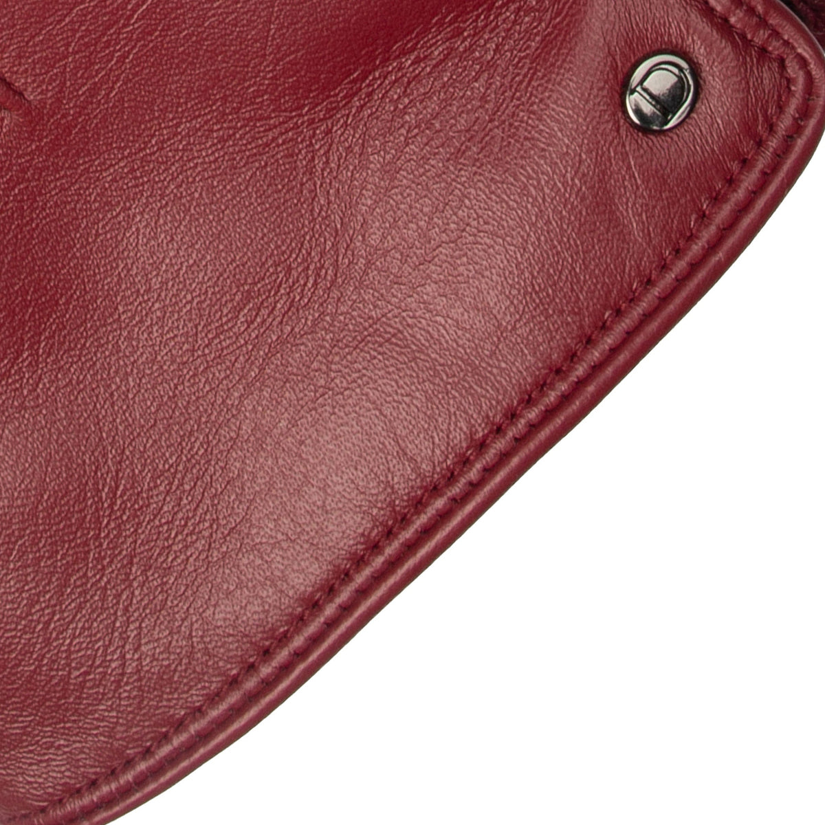 Women's touchscreen single point faux fur lined leather gloves in red, cuff close. 