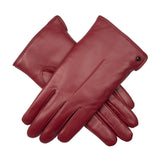 Women's touchscreen single point faux fur lined leather gloves in red, crossed position.