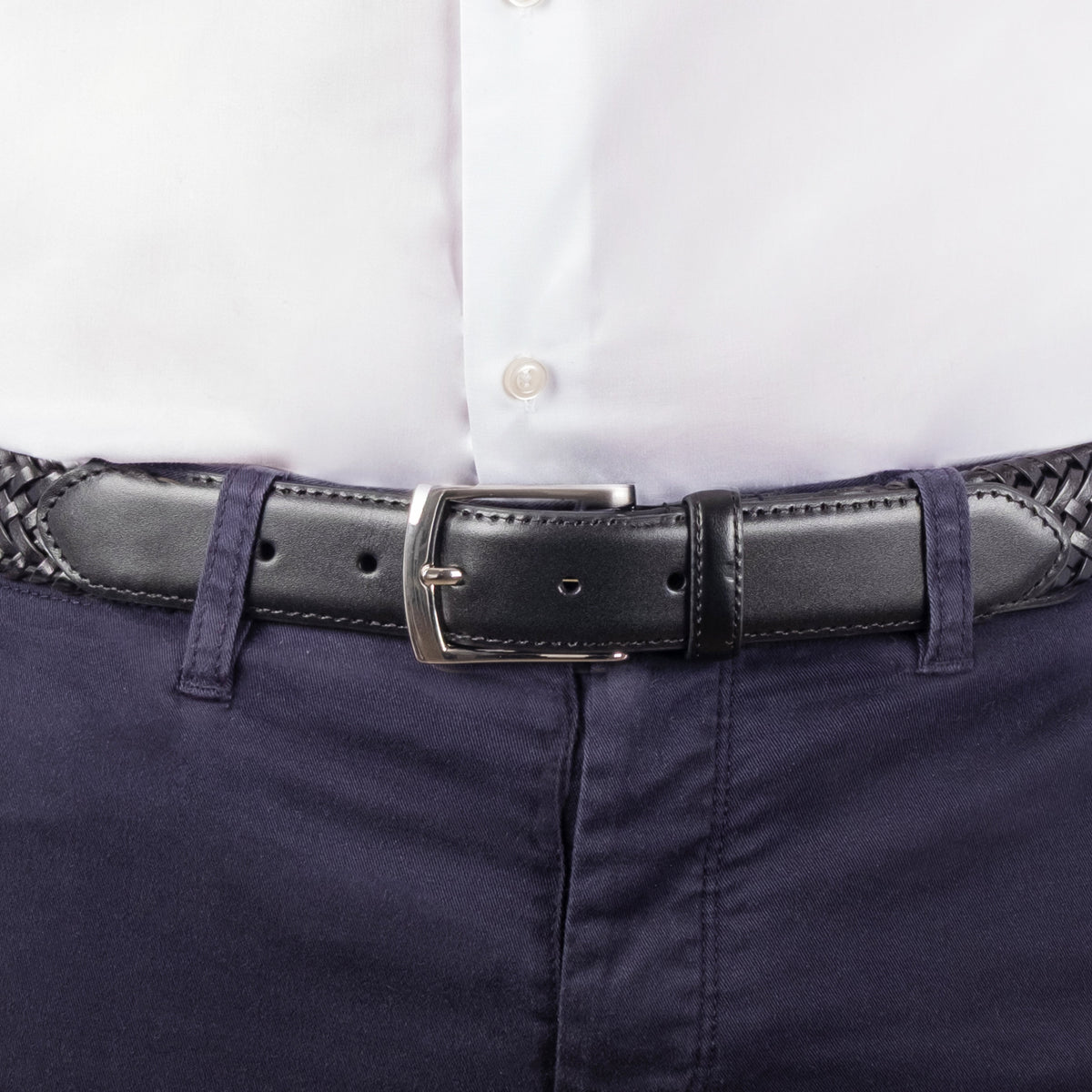 Man wearing woven leather belt with satin nickel buckle in black, buckle close up