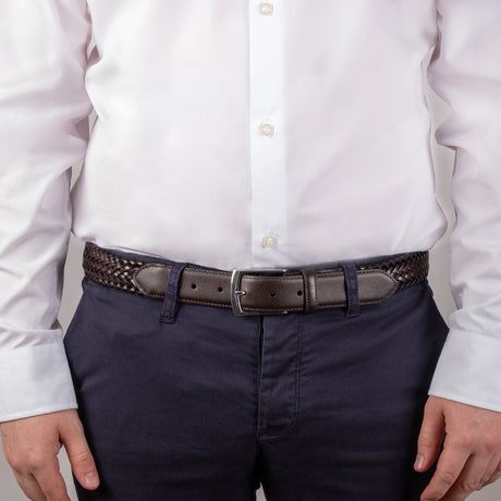 Men's woven leather belt with satin nickel buckle in brown, close up 