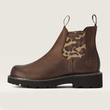 Brown leather boot with leopard print patch on a beige background