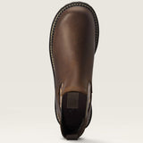 Brown leather boot on a beige background