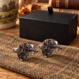 Pewter Labrador head cufflinks displayed on country tweed in front of Farley's black presentation box