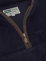 Close-up of a navy jacket with a zipper and 'Field Pro Hogg's of Fife' logo.