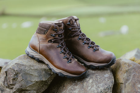 Meindl Peru GTX and Peru Lady GTX boots outdoors beside a dry stone wall