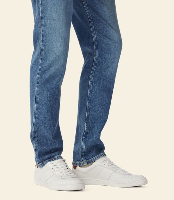 RM Williams Men's Sandbar Leather Trainers - White, worn with jeans