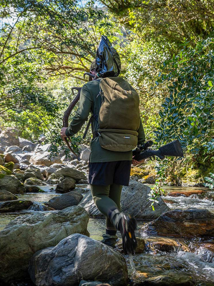SWAZI Buffalo Bag Olive, worn walking through woodland