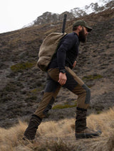 SWAZI Buffalo Bag Tussock, worn walking on a hillside