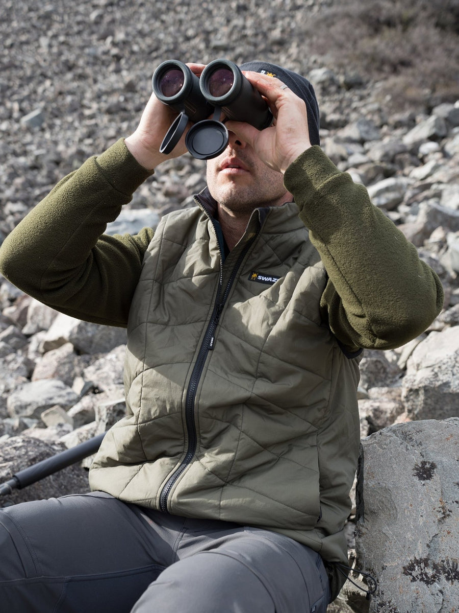 SWAZI Chamois Insulation Vest Mens Ranger, worn outdoors using binoculars
