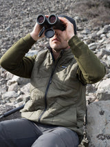 SWAZI Chamois Insulation Vest Mens Ranger, worn outdoors using binoculars