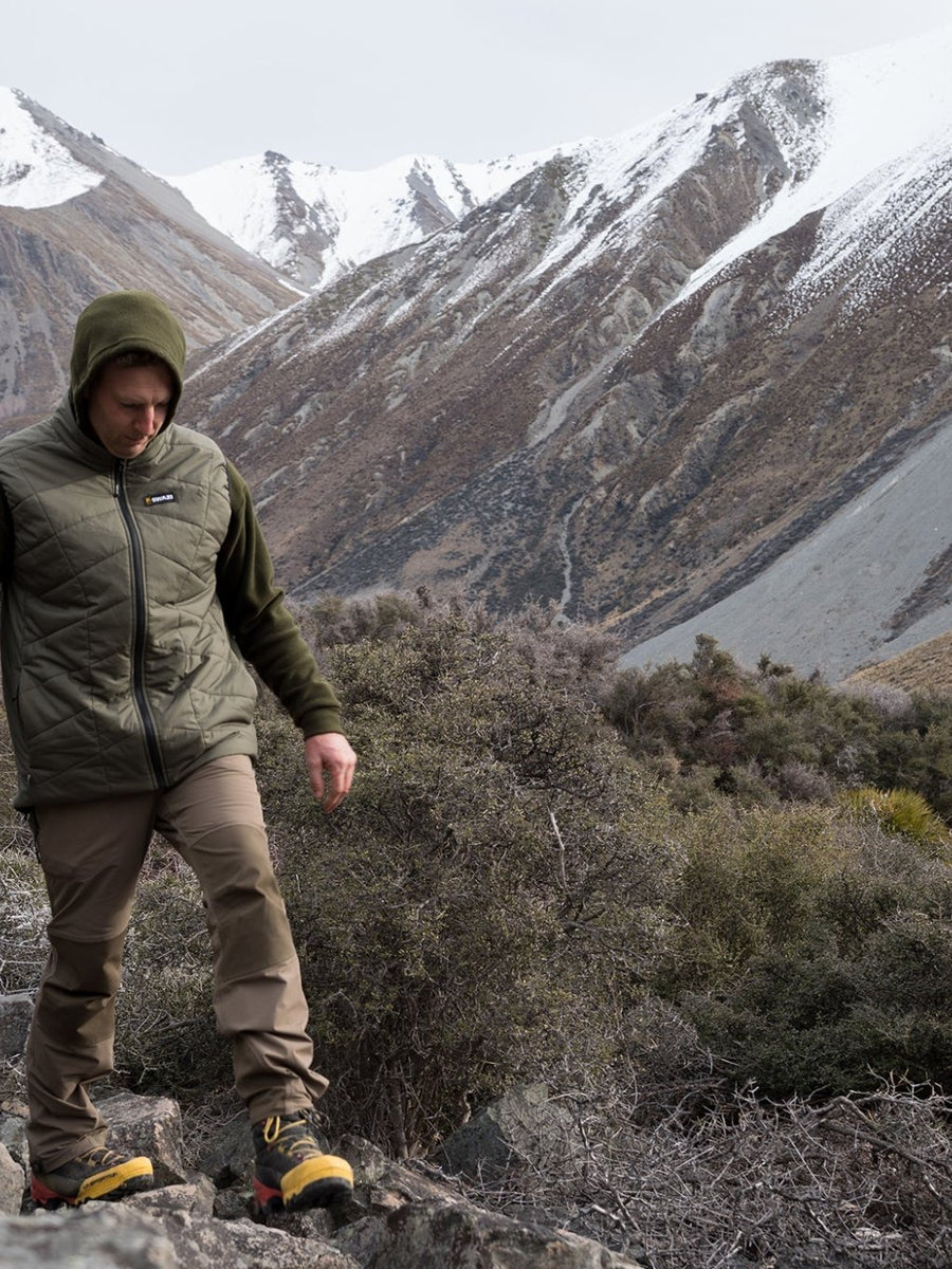 SWAZI Chamois Insulation Vest Mens Ranger, worn walking in mountain terrain