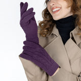 Woman wearing cable knit gloves in amethyst