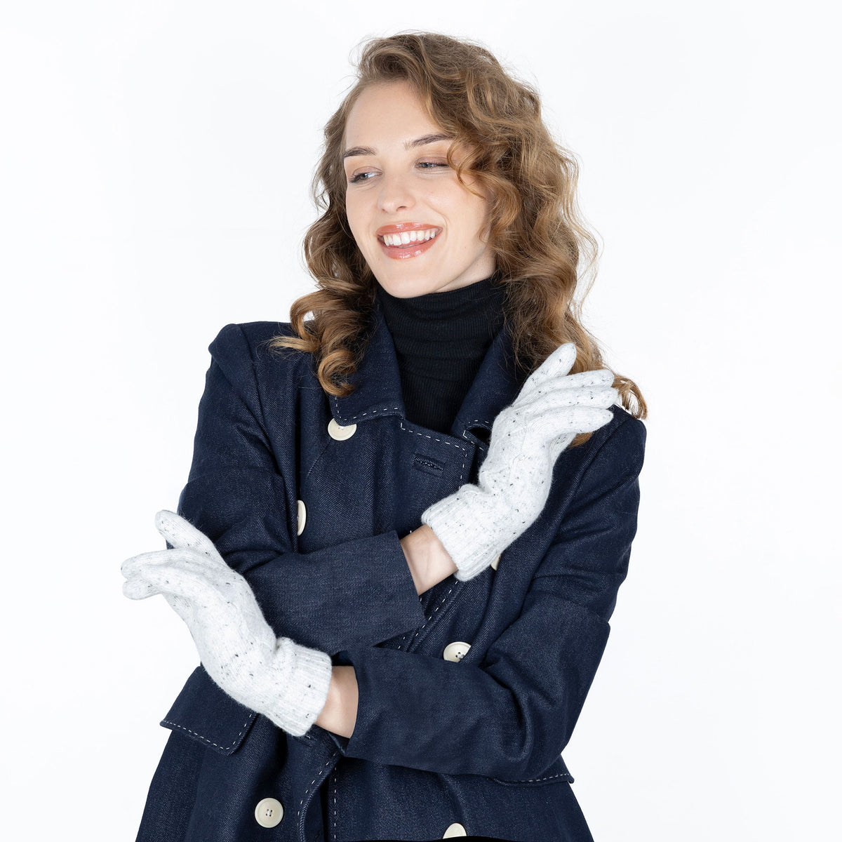 Woman wearing lace knit gloves with marl yarn in winter white