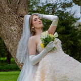Woman wearing Women's Long Satin Gloves in White with wedding dress