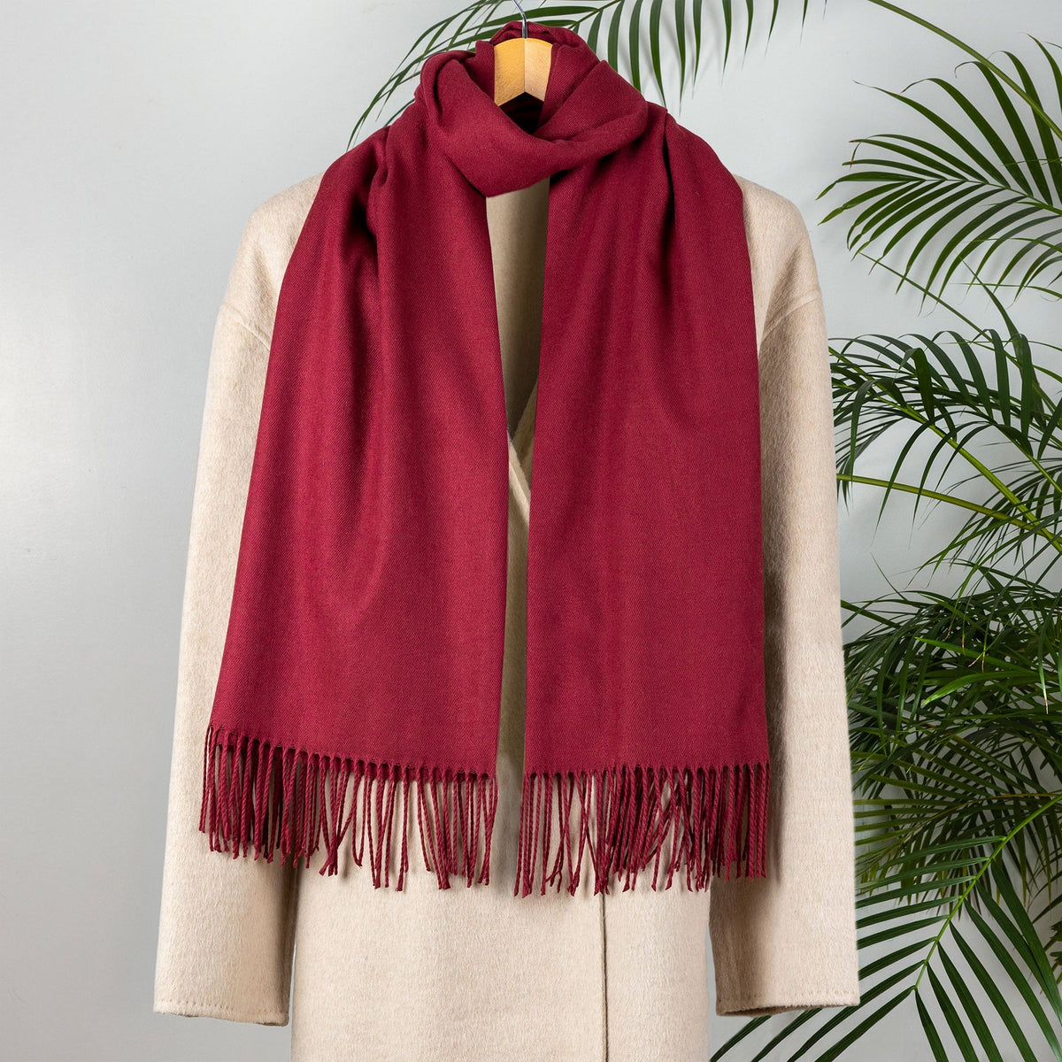 Women's pashmina shawl in burgundy, over a coat