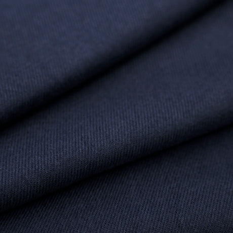Close up of folded women's pashmina shawl in navy