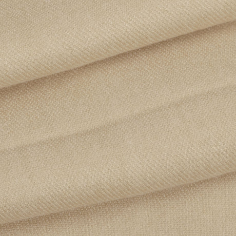 Close up of a folded up women's pashmina shawl in oat