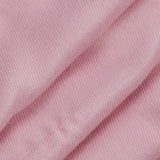 Close up of a folded women's plain pashmina shawl in pale pink