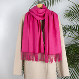 Women's plain pashmina in hot pink on a camel coat 