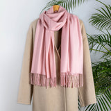 Women's plain pashmina in pale pink on a camel coat 