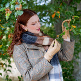 woman wearing silk-lined leather gloves in toffee walking around the woodlands